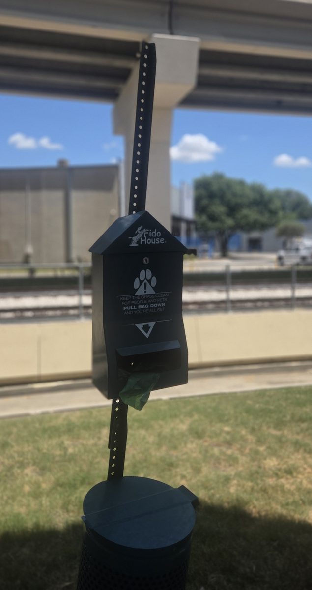 Pet waste station with bag dispenser and waste bin serviced by UrbanTail Cleanup