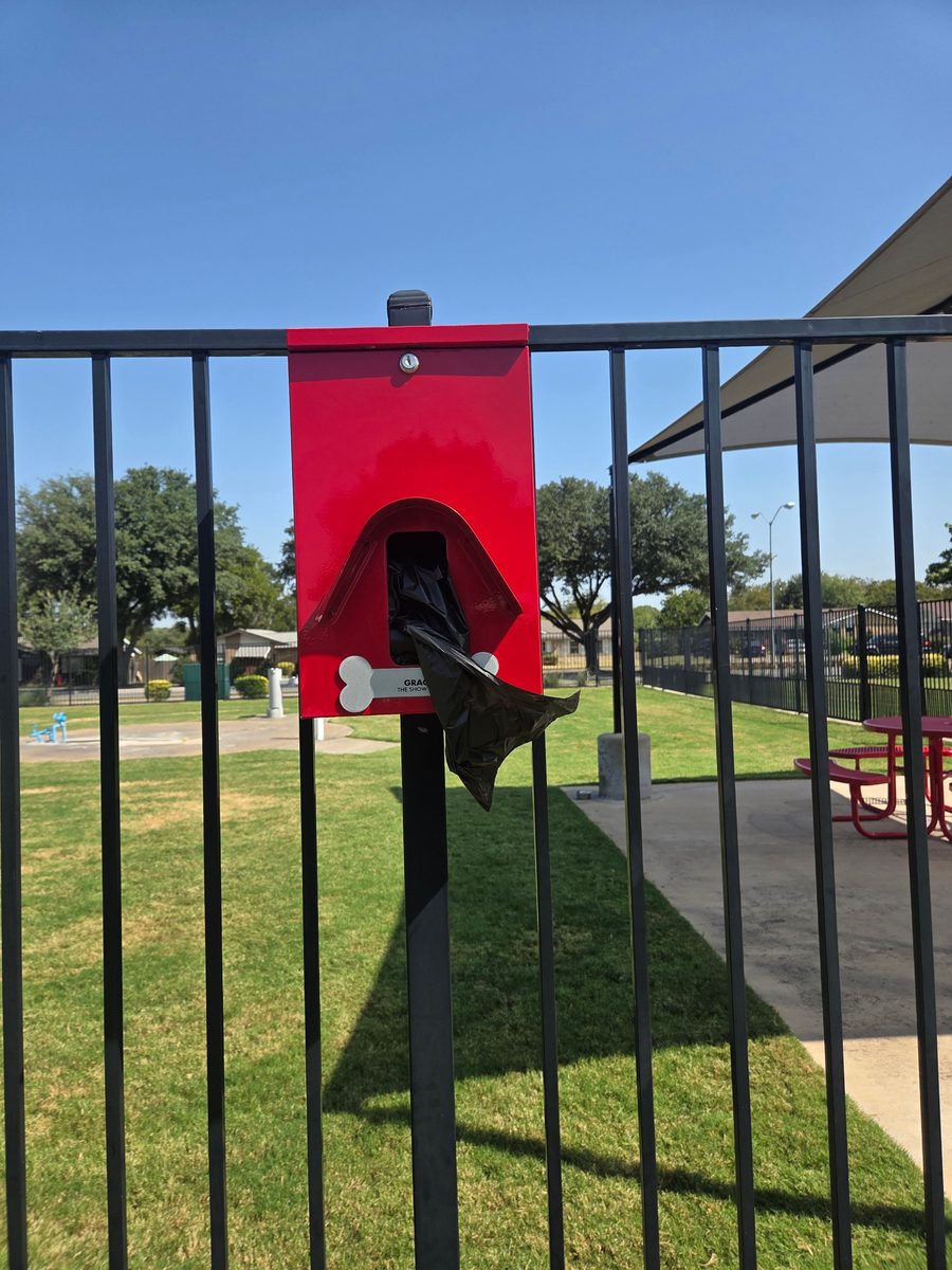 Pet waste bag dispenser at a dog park in Farmers Branch, TX