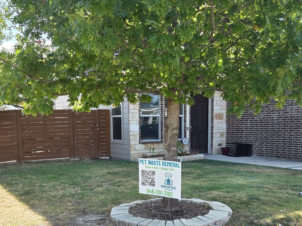 UrbanTail Cleanup pet waste removal yard sign in front of a home in Southwest Oak Cliff, Dallas