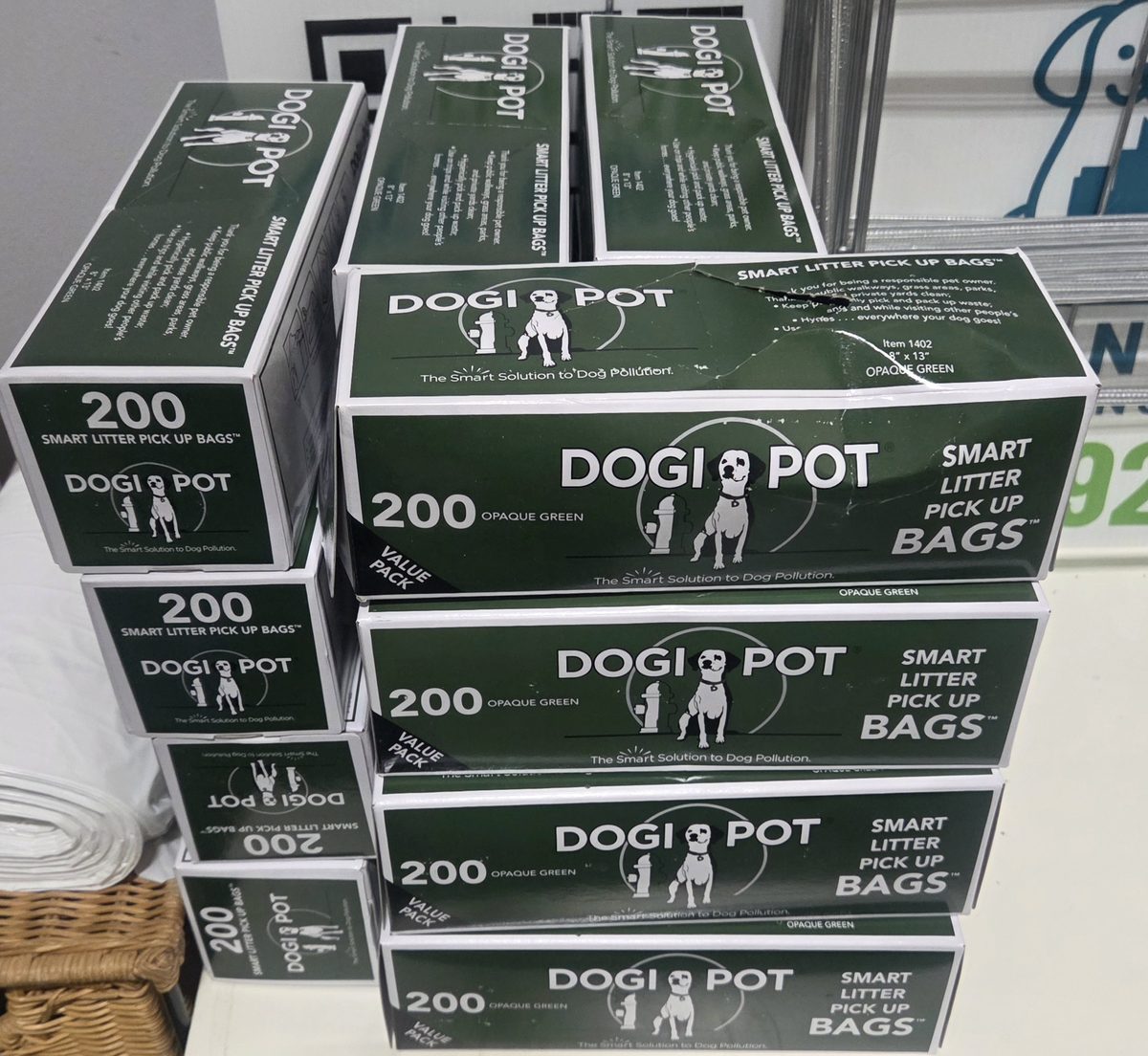 Cases of pet waste bags stocked by UrbanTail Cleanup for restocking apartment pet waste stations